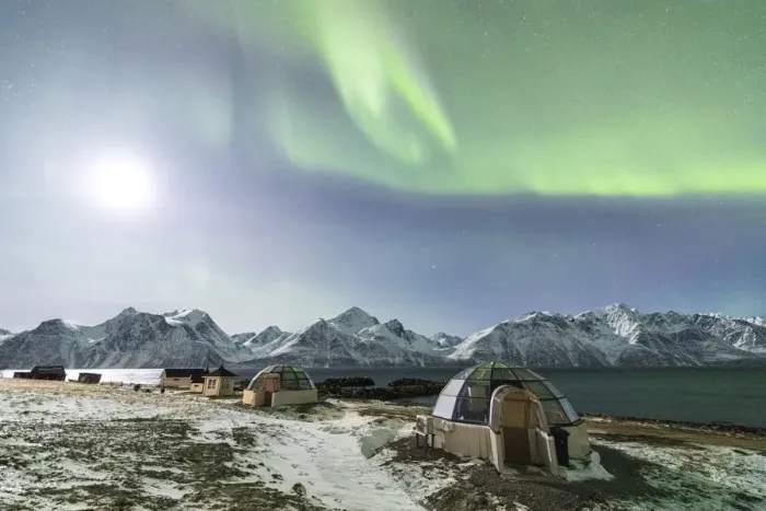 Framed Print : The Northern Lights and moon illuminate the glass igloos framed by icy sea Djupvik Lyngen Alps Tromso Norway Europe