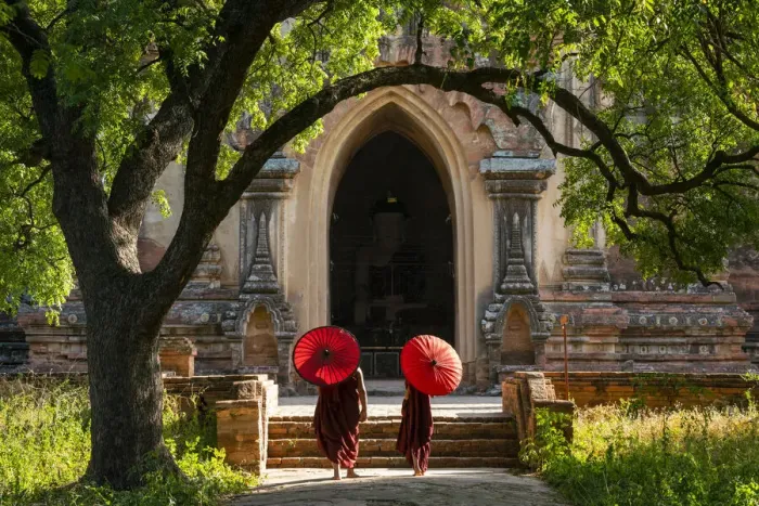 Framed Print : Two novice Buddhist monks with red umbrellas walking to temple, Bagan, Mandalay Region Framed Print : Two novice Buddhist monks with red umbrellas walking to temple, Bagan, Mandalay Region