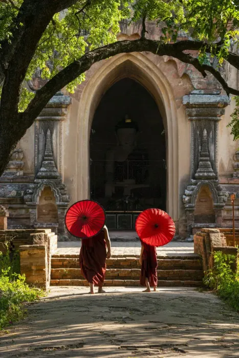 Framed Print : Two novice Buddhist monks with red umbrellas walking to temple, Bagan, Mandalay Region Framed Print : Two novice Buddhist monks with red umbrellas walking to temple, Bagan, Mandalay Region