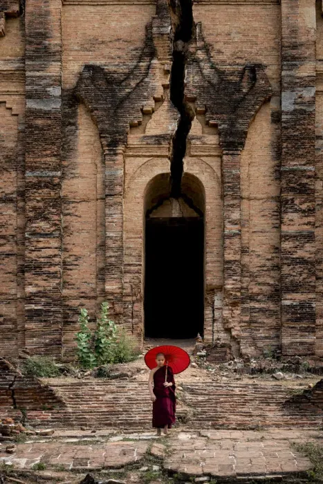 Framed Print : Novice monk standing in front of the unfinished Pahtodawgyi pagoda known for a crack Framed Print : Novice monk standing in front of the unfinished Pahtodawgyi pagoda known for a crack