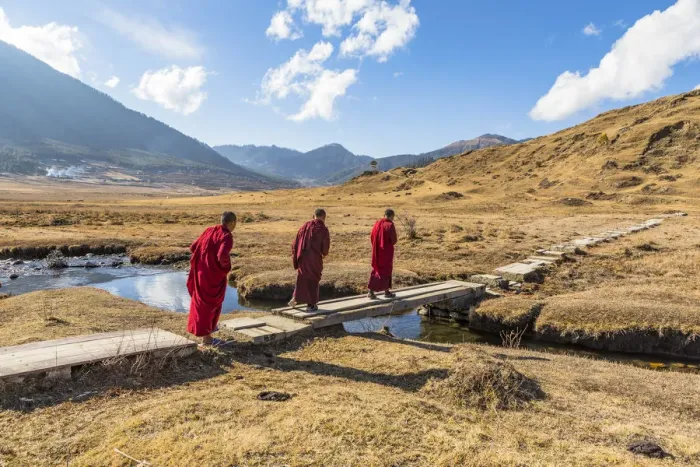 Framed Print : Novice Monks (Child Monks) crossing a river in Phobjikha Valley, Bhutan Framed Print : Novice Monks (Child Monks) crossing a river in Phobjikha Valley, Bhutan