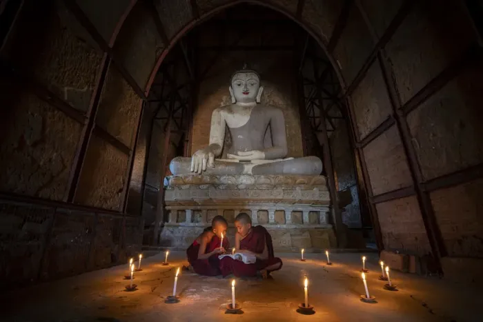 Framed Print : Two novice monks studying inside a temple under big Buddha statue, UNESCO, Bagan Framed Print : Two novice monks studying inside a temple under big Buddha statue, UNESCO, Bagan