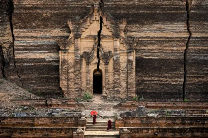 Framed Print : Two novice monks walking towards unfinished Pahtodawgyi pagoda known for a crack caused