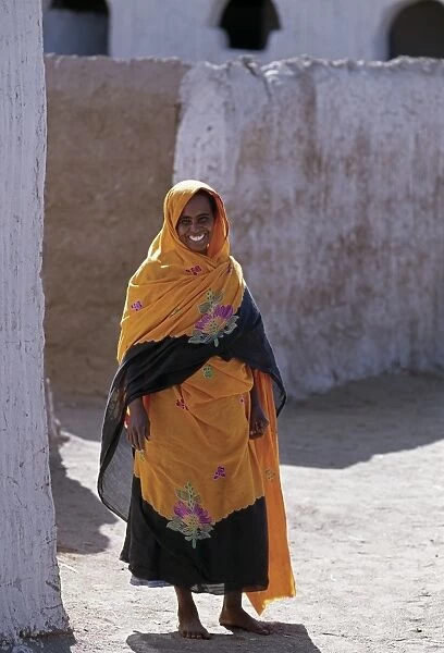 Nubian women wear bright dresses and headscarves even though they are Muslims