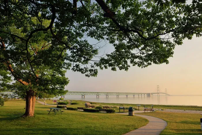 Framed Print : Oak tree overlooking a park on the shore of Straits of Mackinac, Lake Huron, with the Mackinac Bridge, Mackinaw city, Michigan, USA Framed Print : Oak tree overlooking a park on the shore of Straits of Mackinac, Lake Huron, with the Mackinac Bridge, Mackinaw city, Michigan, USA