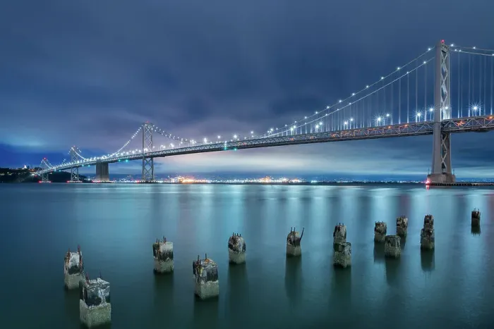 Framed Print : Oakland Bay Bridge against cloudy sky at twilight, San Francisco, San Francisco Peninsula, San Francisco Bay Area, California, USA