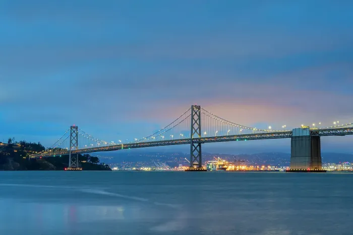 Framed Print : Oakland Bay Bridge against cloudy sky at twilight, San Francisco, San Francisco Peninsula, San Francisco Bay Area, California, USA Framed Print : Oakland Bay Bridge against cloudy sky at twilight, San Francisco, San Francisco Peninsula, San Francisco Bay Area, California, USA