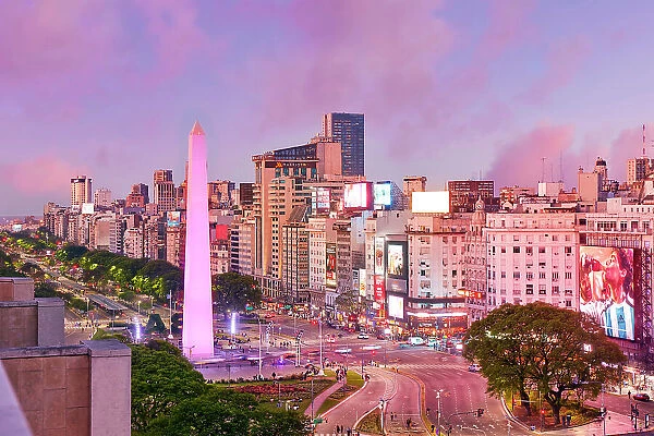 The Obelisk monument illuminated at twilight on the Avenida 9 de Julio, San Nicolas, Buenos Aires, Argentina