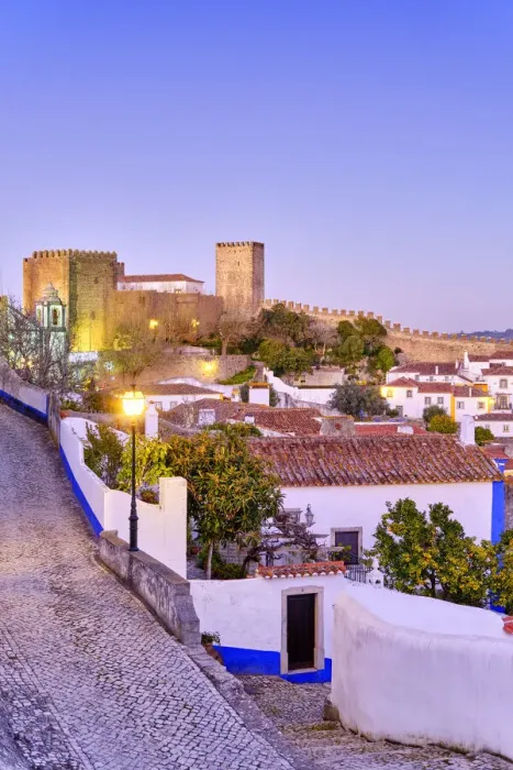 Framed Print : Obidos and the castle at dusk. A traditional medieval village taken to the moors in Framed Print : Obidos and the castle at dusk. A traditional medieval village taken to the moors in