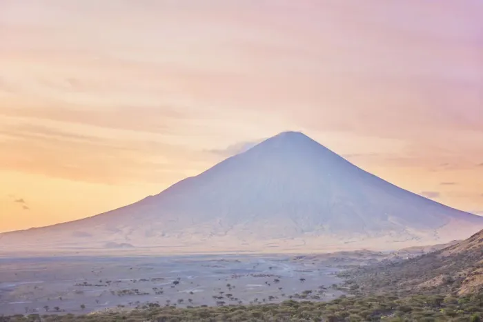 Framed Print : The Ol Doinyo Lengai'volcano at sunrise, Arusha Region, Tanzania. An active volcano in the Gregory Rift, south of Lake Natron, considered by the Msai people as The Mountain of God Framed Print : The Ol Doinyo Lengai'volcano at sunrise, Arusha Region, Tanzania. An active volcano in the Gregory Rift, south of Lake Natron, considered by the Msai people as The Mountain of God