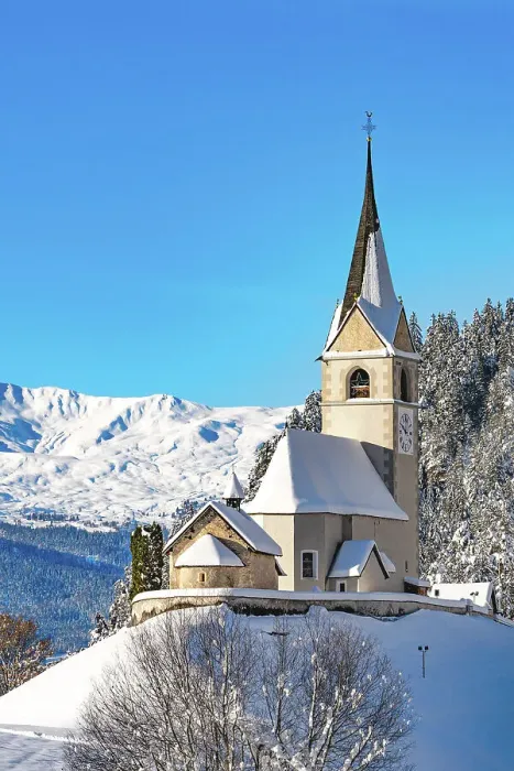 Framed Print : Old bell tower and church with snowcapped mountains on background, Alvaneu, Davos, Graubunden canton, Switzerland Framed Print : Old bell tower and church with snowcapped mountains on background, Alvaneu, Davos, Graubunden canton, Switzerland