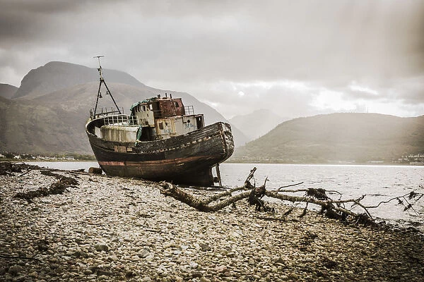 The Old Boat of Corpach with Ben Nevis in the background, Fort William, Scotland, UK
