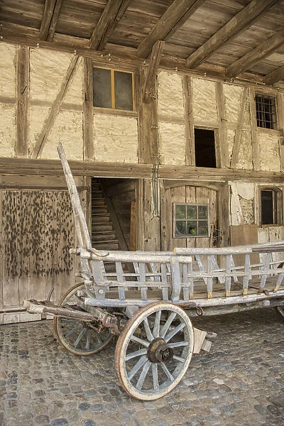 Old cart by a farmhouse, Emmental Valley, Berner Oberland, Switzerland