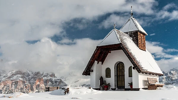 An old church on the top of the mountain in italian alps during winter season, Alta Badia
