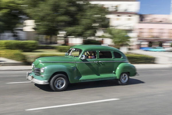 old classic american car drives in Havana, Cuba