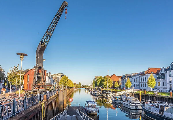 Old crane at the inland port of Oldenburg, Oldenburger Land, Lower Saxony, Germany