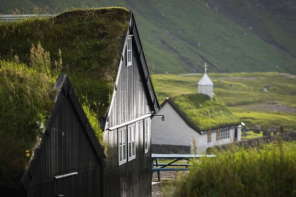 The old Duvugarðar farm and the church of Saksun. Stryemoy, Faroe Islands