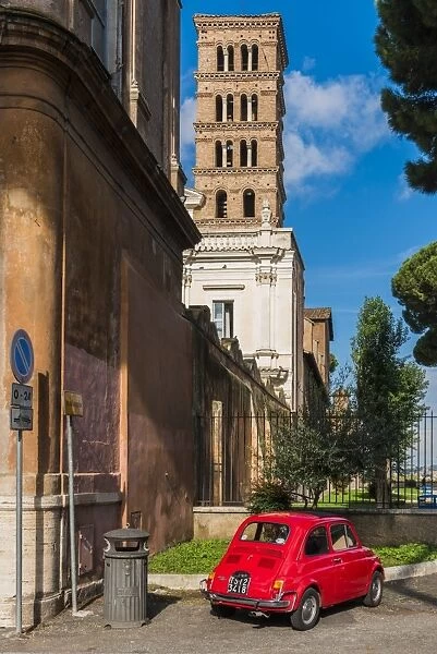 Old Fiat 500 car parked with Basilica dei Santi Bonifacio ed Alessio in the background