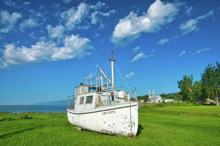 Framed Print : Old fishing boat on shore of St. Lawrence River, Quebec, Canada