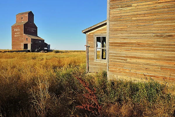 Old general store and grain elevator in ghost town Bents Saskatchewan, Canada
