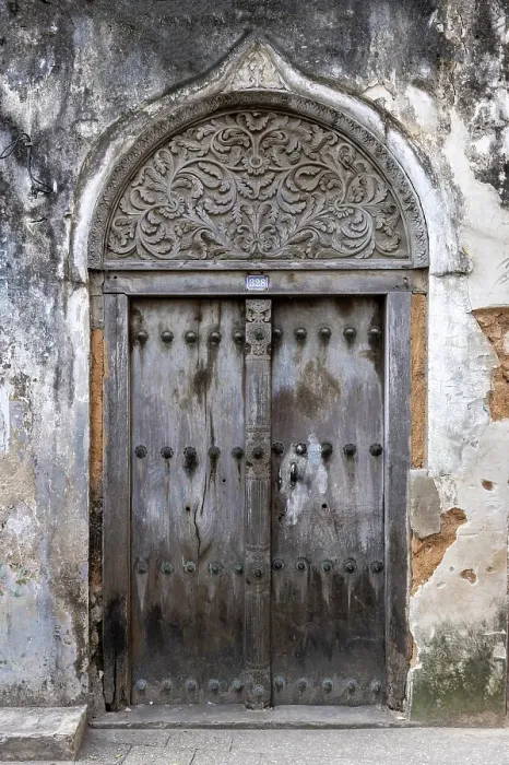 Framed Print : Old heavy carved wooden door, Stonetown, Zanzibar, Tanzania Framed Print : Old heavy carved wooden door, Stonetown, Zanzibar, Tanzania