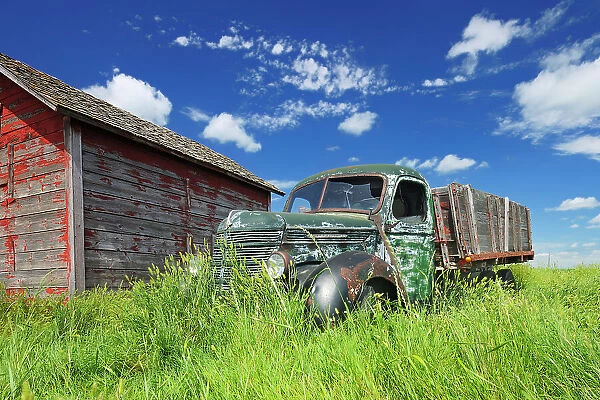 Old International truck and wodden grainery on farm Hazenmore Saskatchewan, Canada
