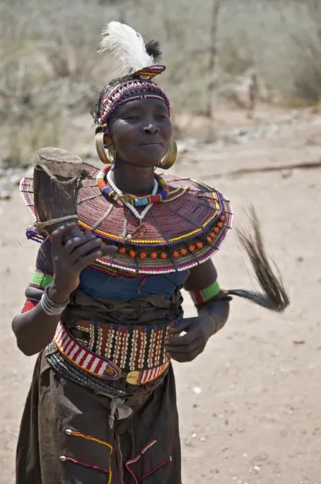 Framed Print : An old Pokot woman dancing during an Atelo ceremony. The cow horn container usually contains animal fat Framed Print : An old Pokot woman dancing during an Atelo ceremony. The cow horn container usually contains animal fat