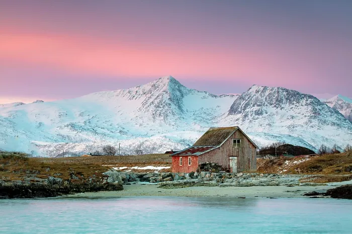 Framed Print : Old red wooden barn (rorbu) and snow-covered mountains beneath a pink sky at dawn, Sommeroy, near Tromso, Norway Framed Print : Old red wooden barn (rorbu) and snow-covered mountains beneath a pink sky at dawn, Sommeroy, near Tromso, Norway