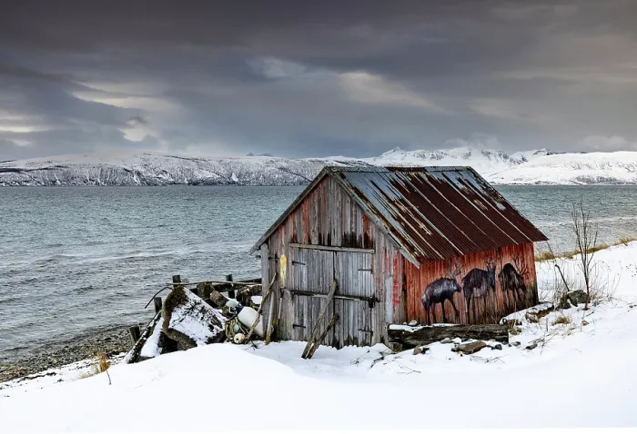 Framed Print : Old red wooden hut (rorbu) in snow, near Straumsgard, near Tromso, Norway