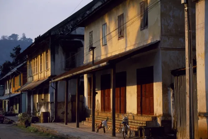 Framed Print : Old shuttered houses in the main street