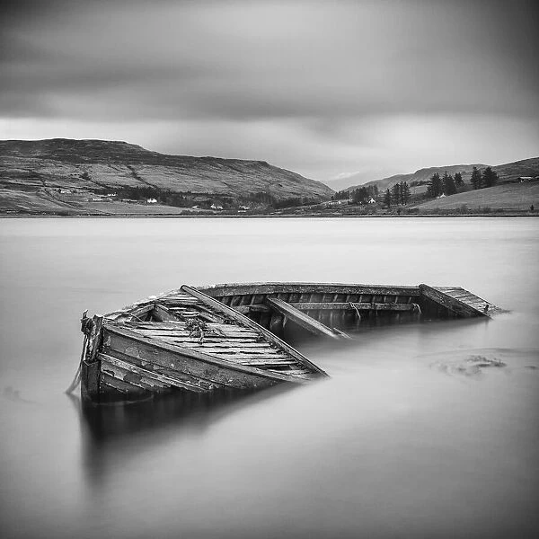An old sunken boat in Loch Harport, Isle of Skye, Scotland