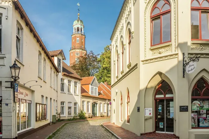 Framed Print : Old town alley with a view of the Great Church, Leer, East Frisia, Lower Saxony, Germany Framed Print : Old town alley with a view of the Great Church, Leer, East Frisia, Lower Saxony, Germany