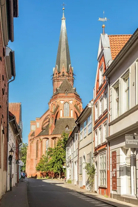 Framed Print : Old town street with St. Nicolai church, Luneburg, Lower Saxony, Germany Framed Print : Old town street with St. Nicolai church, Luneburg, Lower Saxony, Germany