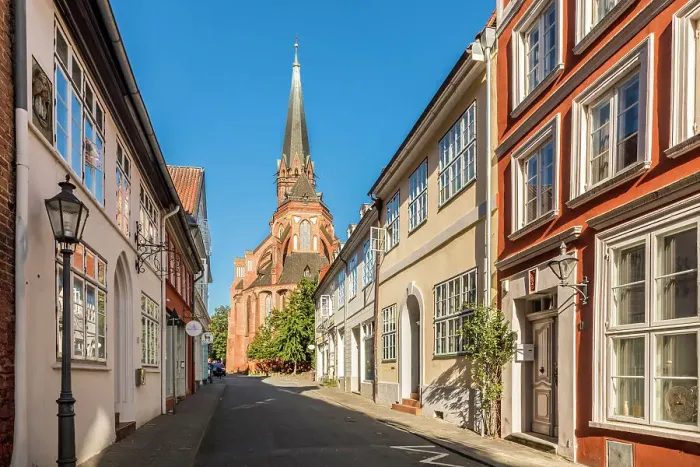 Framed Print : Old town street with St. Nicolai church, Luneburg, Lower Saxony, Germany Framed Print : Old town street with St. Nicolai church, Luneburg, Lower Saxony, Germany