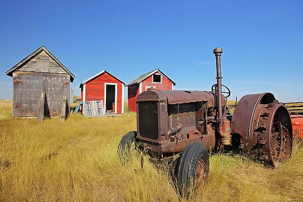 Old tractor and sheds Fusilier Saskatchewan, Canada