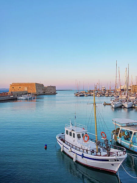 Old Venetian Port and The Koules Fortress at sunset, City of Heraklion, Crete, Greece