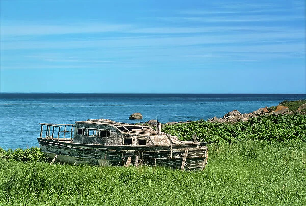 Old wooden fishing boat on shore of Gulf of St. Lawrence Ste-Felicite, Quebec, Canada