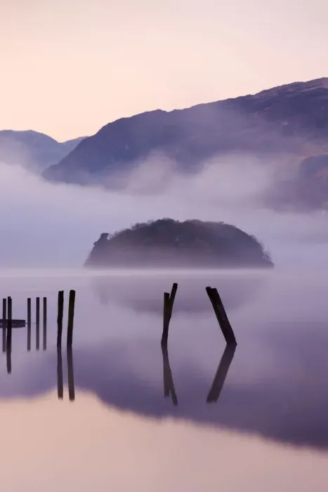 Framed Print : Old wooden jetty and St Herberts Island on Derwent Water at dawn on a misty Framed Print : Old wooden jetty and St Herberts Island on Derwent Water at dawn on a misty