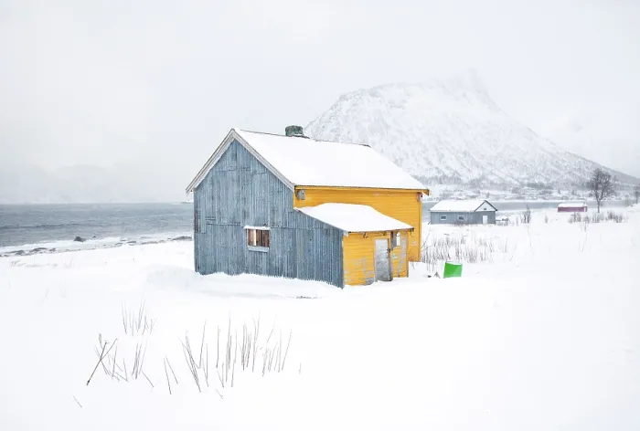 Framed Print : Old yellow and blue timber house in the snow, Senjahopen, Senja, Norway Framed Print : Old yellow and blue timber house in the snow, Senjahopen, Senja, Norway