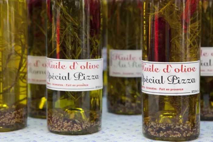 Framed Print : Olive oils for sale in the market in St Remy France Framed Print : Olive oils for sale in the market in St Remy France