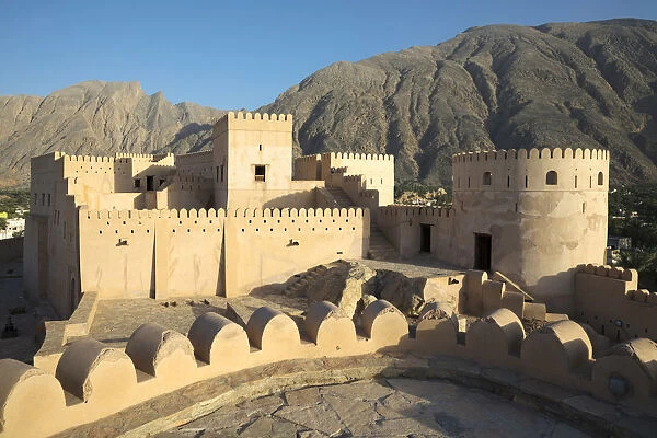 Oman, Al-Batinah Region, Nakhal, Nakhal Fort with the Jebel Nakhal mountains in the