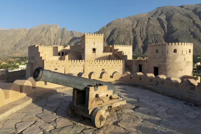 Framed Print : Oman, Al-Batinah Region, Nakhal, Nakhal Fort and cannon located at the foot of Jebel