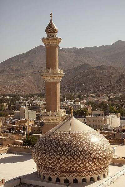 Oman, Nizwa. The iconic dome and minaret of Nizwa Mosque are often used to symbolise Oman