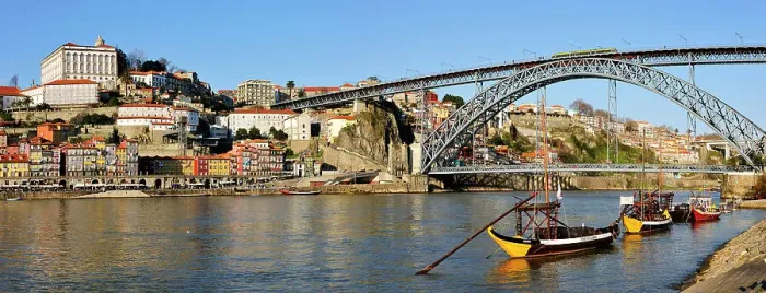 Framed Print : Oporto, capital of the Port wine and the Douro river. The bridge Dom Luis, a UNESCO World Heritage Site. In the foreground the traditional boats called Rabelos'. Portugal Framed Print : Oporto, capital of the Port wine and the Douro river. The bridge Dom Luis, a UNESCO World Heritage Site. In the foreground the traditional boats called Rabelos'. Portugal