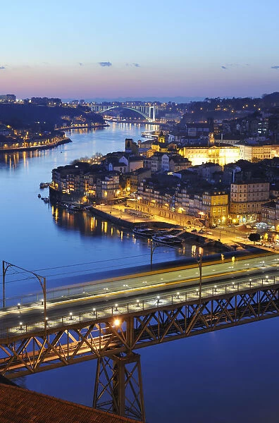 Oporto, capital of the Port wine, with the Douro river and Dom Luis bridge at sunset