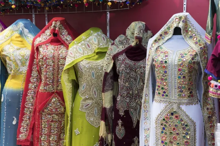 Framed Print : Ornate dresses for sale in Mutrah souk, Muscat, Oman