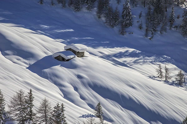 Orobie alps, chalet snowy in Bitto valley, Lombardy, Italy