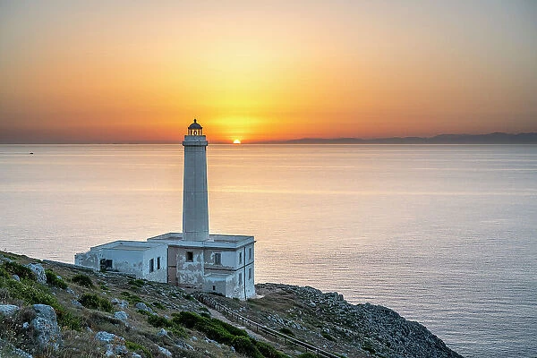 Otranto, province of Lecce, Salento, Apulia, Italy. Sunrise at the lighthouse Faro della Palascia. This lighthouse marks the most easterly point of the Italian mainland