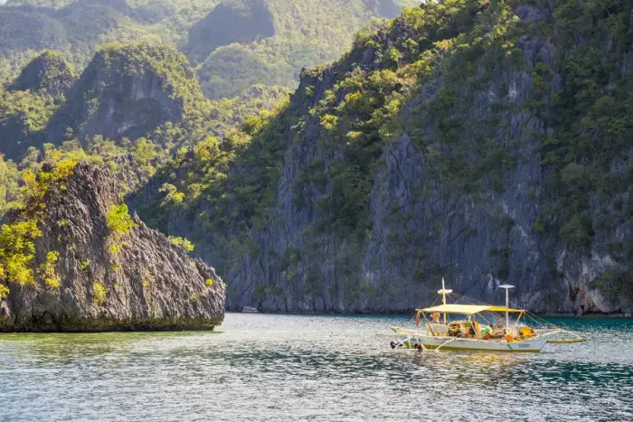 Framed Print : Outrigger boat anchored at Twin Peaks Reef off the coast of Coron Island, Coron, Palawan Framed Print : Outrigger boat anchored at Twin Peaks Reef off the coast of Coron Island, Coron, Palawan