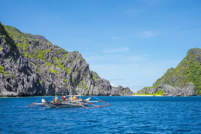 Framed Print : Outrigger boat passing Tapiutan Island, El Nido, Palawan, Philippines Framed Print : Outrigger boat passing Tapiutan Island, El Nido, Palawan, Philippines